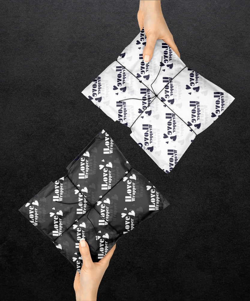 Eco-friendly tissue paper with engraved logo wrapping a gift box, demonstrating adaptable sizing and premium unboxing experience for retail branding.