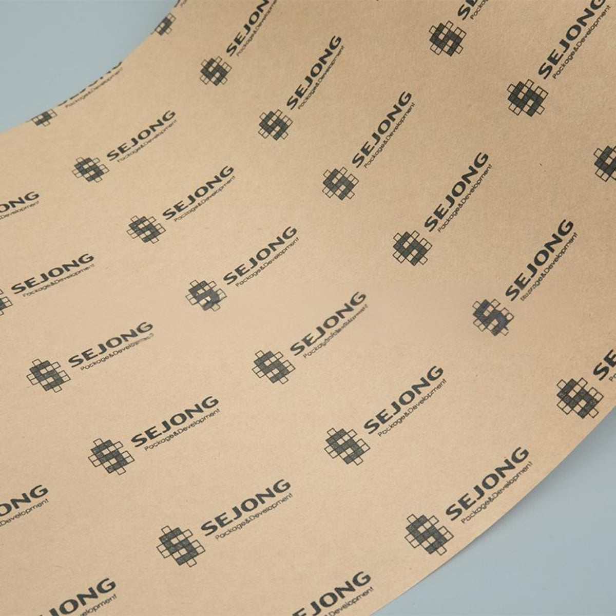 Pantone Color Matched Kraft Paper with Embossed Brand Logo for Luxury Retail