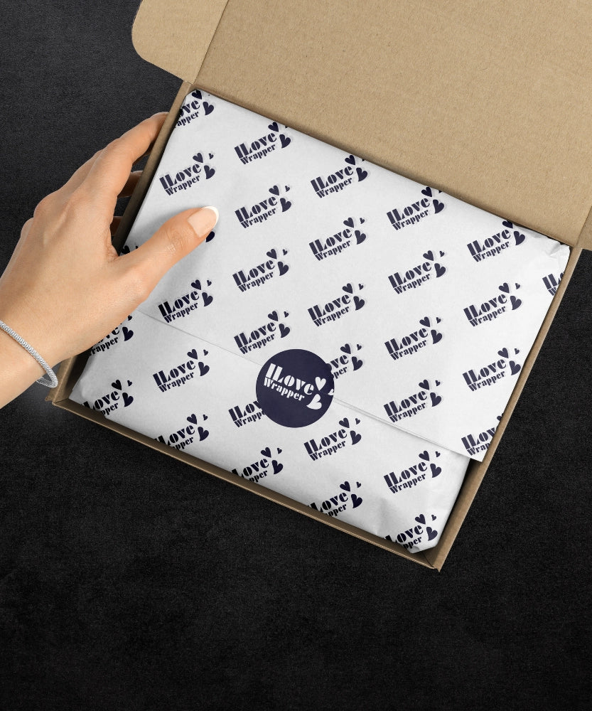 Close-up of archival-grade tissue paper with precision Intaglio-engraved brand logo, showcasing GSM thickness variations for custom packaging solutions.