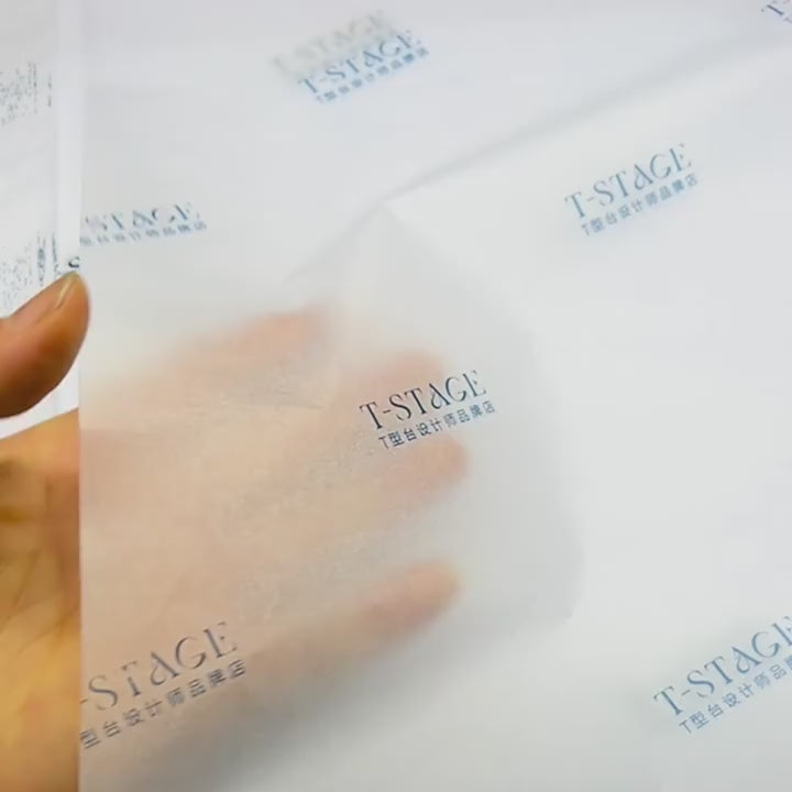Load video: Close-up video showcasing logo engraving process on 30% recycled tissue paper. Demonstrates customizable branding, bulk order discounts, and eco-friendly material texture.